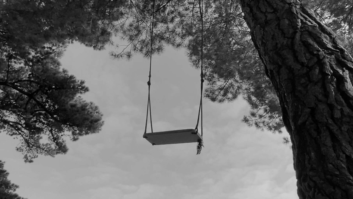 black and white still of swing