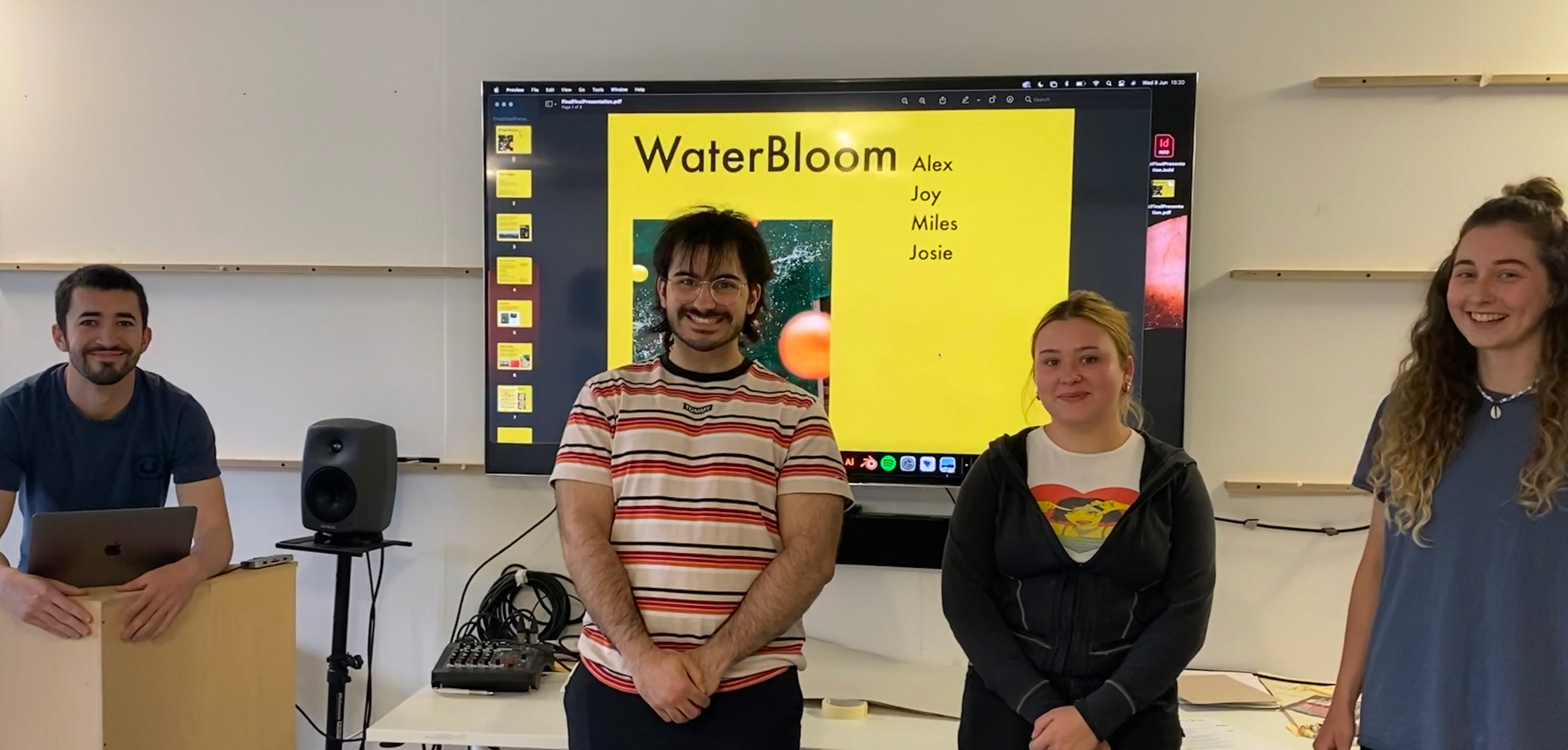 group in front of presentation screen